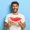 Waist up shot of smiling man enjoys summer day, holds slice of fresh ripe watermelon, wants to eat delicious fruit, wears casual white t shirt, isolated on blue background, has picnic during weekend